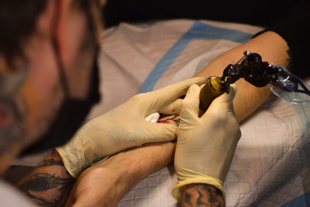Tattoo artist working in the Trade Mark Tattoo studio
